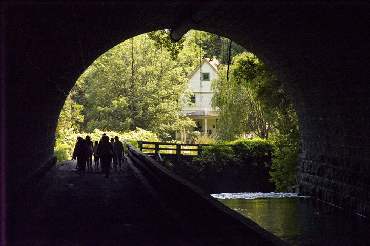 People walking through the tunnel at Corbett's Glen Nature Park.